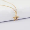 Outlet HappyBulle Pendentif enfant étoile de mer scintillante zircons bleus plaqué or 15 mm