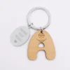 New HappyBulle Porte clé personnalisé médaille gravée ovale acier et breloque bois alphabet Barbapapa - x Barbapapa