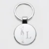 Online HappyBulle Porte-clés personnalisé initiale gravé acier rond 37 mm - x Marie Savart